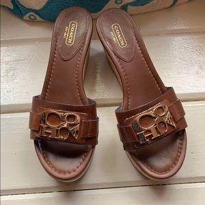 Coach brown leather wedges with gold lettering
